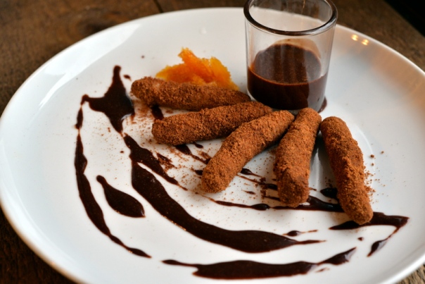 CHURROS - churros with spiced coconut sugar coating, warm cinnamon chocolate dipping sauce, candied orange